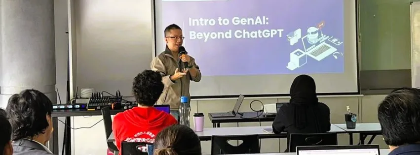 ThengHui presenting a session titled “Intro to GenAI: Beyond ChatGPT” to a full room